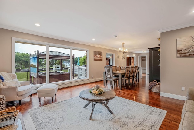 3 Stark Dr, Center Moriches, NY 11934 - living room with ornamental molding, a chandelier, baseboard heating, dark wood-style floors, and recessed lighting