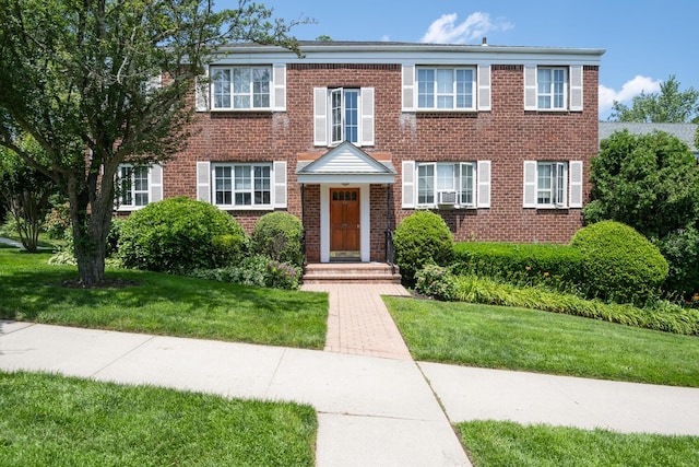 53 Nathan Hale Dr Unit 7A, Huntington, NY 11743 - view of front of home featuring a front lawn and brick siding