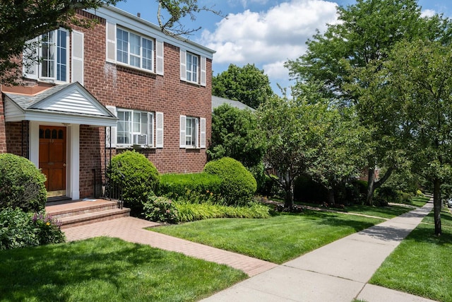 53 Nathan Hale Dr Unit 7A, Huntington, NY 11743 - view of front of property featuring brick siding and a front lawn