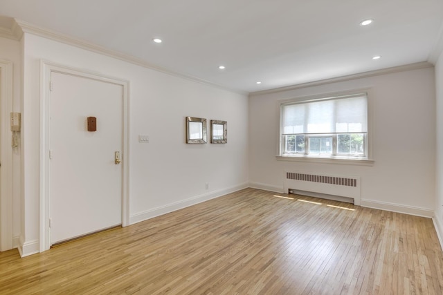 53 Nathan Hale Dr Unit 7A, Huntington, NY 11743 - foyer with radiator heating unit, crown molding, light wood-style flooring, and recessed lighting