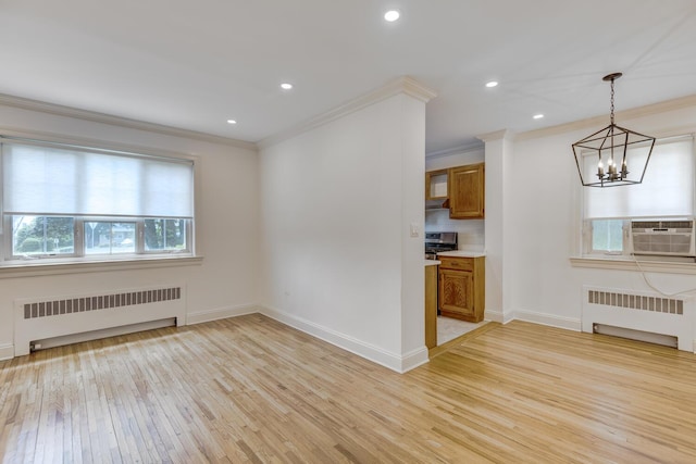 53 Nathan Hale Dr Unit 7A, Huntington, NY 11743 - unfurnished living room featuring radiator heating unit, cooling unit, a chandelier, crown molding, and light wood-style flooring