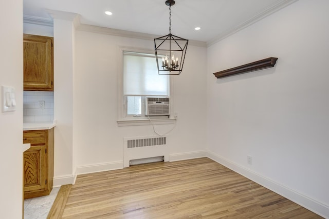 53 Nathan Hale Dr Unit 7A, Huntington, NY 11743 - unfurnished dining area with radiator heating unit, ornamental molding, a chandelier, light wood finished floors, and recessed lighting