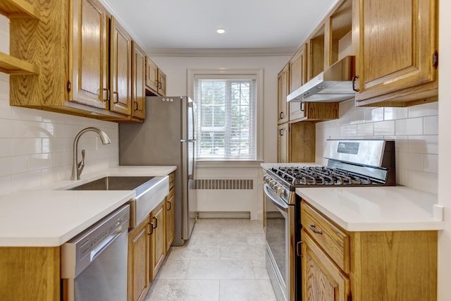 53 Nathan Hale Dr Unit 7A, Huntington, NY 11743 - kitchen with appliances with stainless steel finishes, backsplash, wall chimney range hood, light countertops, and ornamental molding