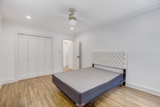 53 Nathan Hale Dr Unit 7A, Huntington, NY 11743 - bedroom featuring light wood-style flooring, crown molding, a closet, and recessed lighting