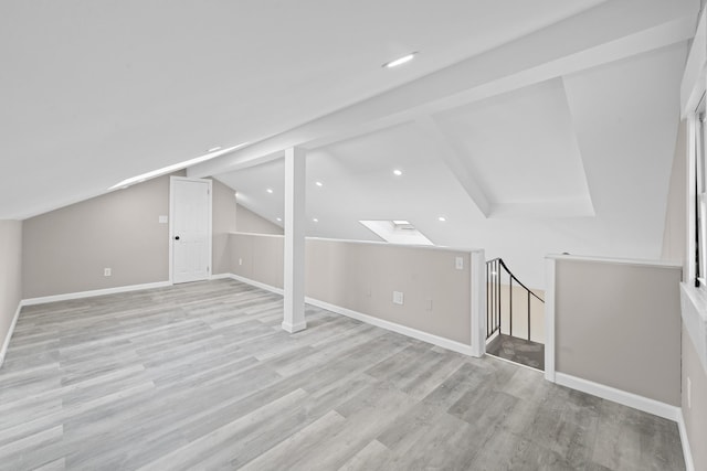 126 Lutz Dr, Valley Stream, NY 11580 - additional living space with a skylight, light wood-type flooring, recessed lighting, and vaulted ceiling