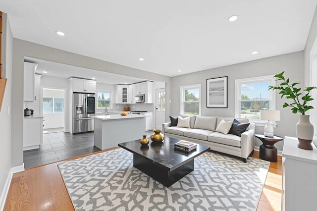 126 Lutz Dr, Valley Stream, NY 11580 - living room with dark wood-type flooring and recessed lighting