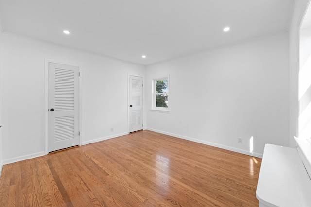 126 Lutz Dr, Valley Stream, NY 11580 - empty room with light wood-style flooring and recessed lighting