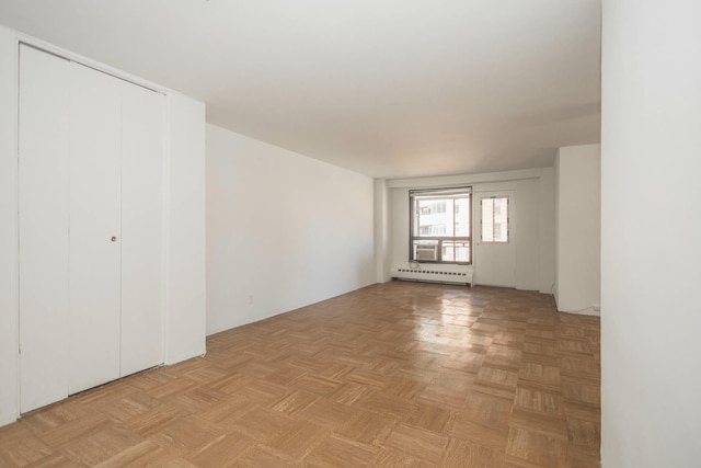 61-25 98th St Unit 11E, Rego Park, NY 11374 - unfurnished room with a baseboard radiator