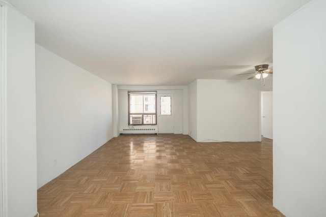 61-25 98th St Unit 11E, Rego Park, NY 11374 - spare room with baseboard heating and ceiling fan