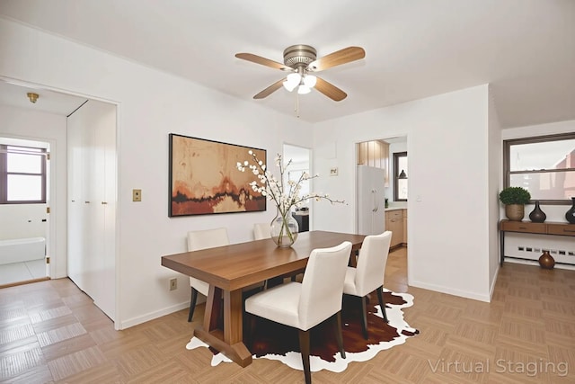 61-25 98th St Unit 11E, Rego Park, NY 11374 - dining space featuring ceiling fan and baseboards