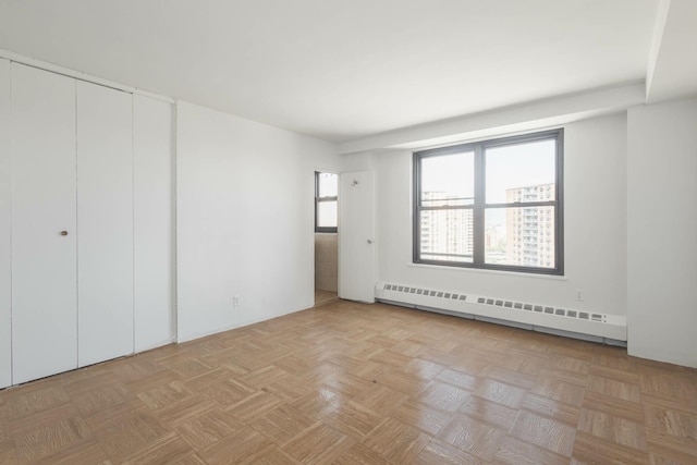 61-25 98th St Unit 11E, Rego Park, NY 11374 - unfurnished bedroom with baseboard heating