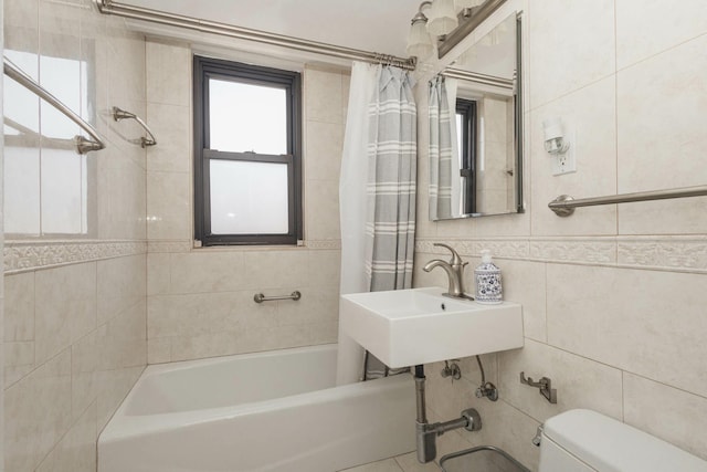 61-25 98th St Unit 11E, Rego Park, NY 11374 - bathroom featuring tile walls and shower / bath combination with curtain