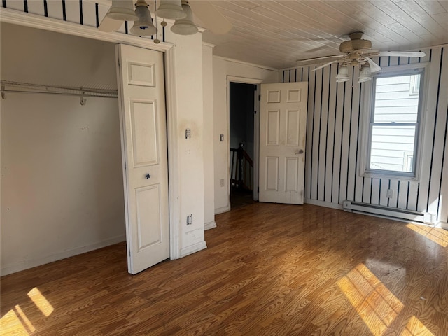 99 W Bridge St, Saugerties, NY 12477 - unfurnished bedroom featuring wood finished floors, a baseboard radiator, ornamental molding, and a closet