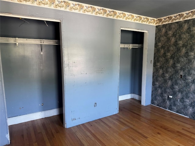 99 W Bridge St, Saugerties, NY 12477 - unfurnished bedroom with wood finished floors and two closets