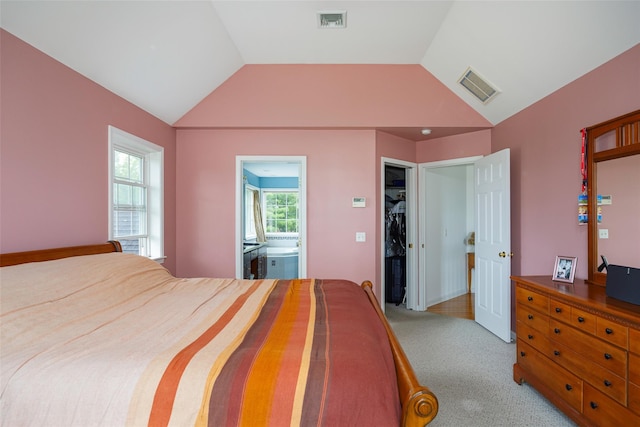7 Frog Hollow Rd, Poughquag, NY 12570 - bedroom with multiple windows, lofted ceiling, a spacious closet, light colored carpet, and ensuite bath