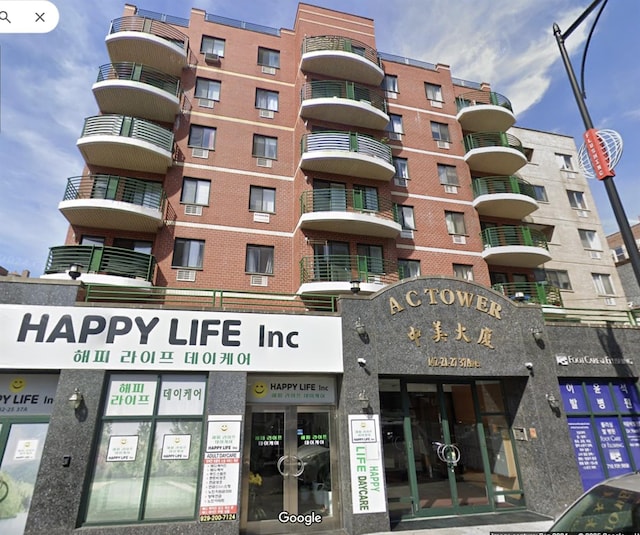142-25 37th Ave Unit 2E, Flushing, NY 11354 - view of apartment building / complex with view of commercial area