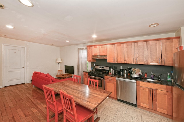 1244 Jefferson Ave, Brooklyn, NY 11221 - kitchen with appliances with stainless steel finishes, under cabinet range hood, dark countertops, and recessed lighting