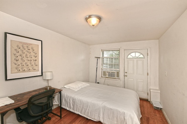 1244 Jefferson Ave, Brooklyn, NY 11221 - bedroom with wood finished floors and cooling unit