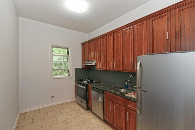 1244 Jefferson Ave, Brooklyn, NY 11221 - kitchen with appliances with stainless steel finishes, under cabinet range hood, dark countertops, and tasteful backsplash