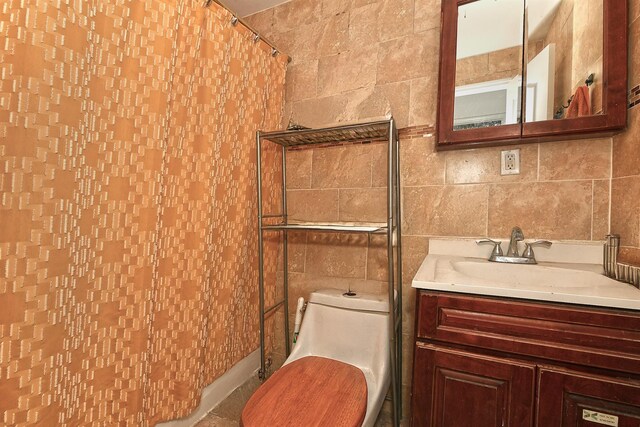 1244 Jefferson Ave, Brooklyn, NY 11221 - bathroom featuring tile walls, vanity, and a shower with shower curtain