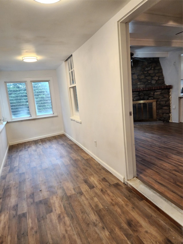 13SLake Drive, Patterson, NY 12563 - unfurnished room featuring dark wood-type flooring and a fireplace