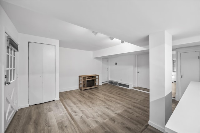1440 Boston Post Unit 8K, Larchmont, NY 10543 - unfurnished living room featuring wood finished floors and baseboards