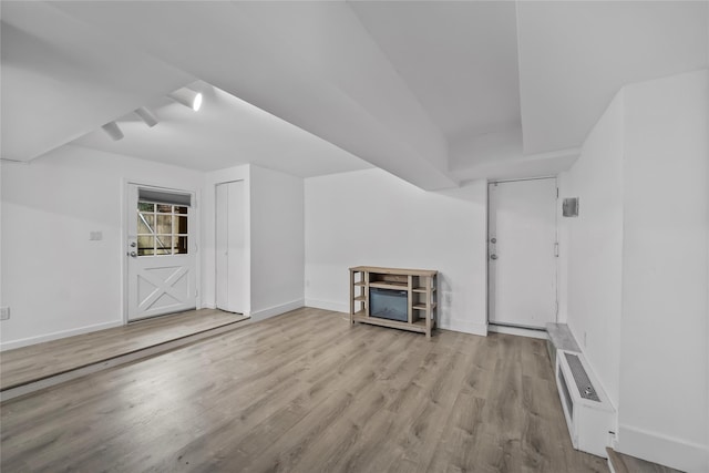 1440 Boston Post Unit 8K, Larchmont, NY 10543 - unfurnished living room with wood finished floors and baseboards