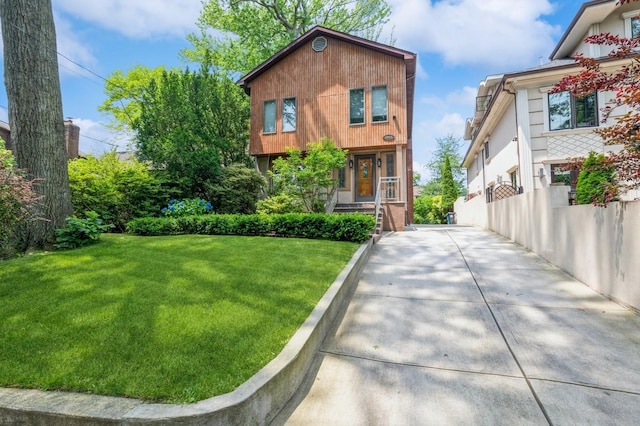 19615 Como Ave, Holliswood, NY 11423 - view of front facade with a front yard, driveway, and a porch