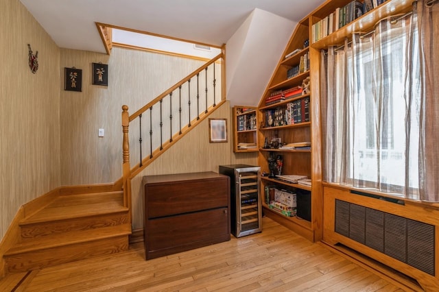 19615 Como Ave, Holliswood, NY 11423 - stairs featuring hardwood / wood-style floors and radiator