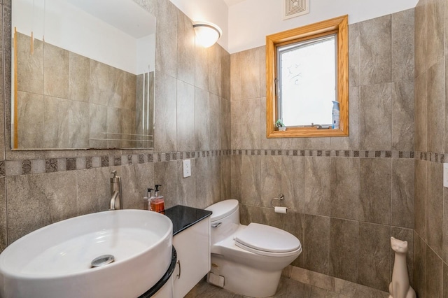 19615 Como Ave, Holliswood, NY 11423 - bathroom with tile walls, vanity, and tile patterned flooring
