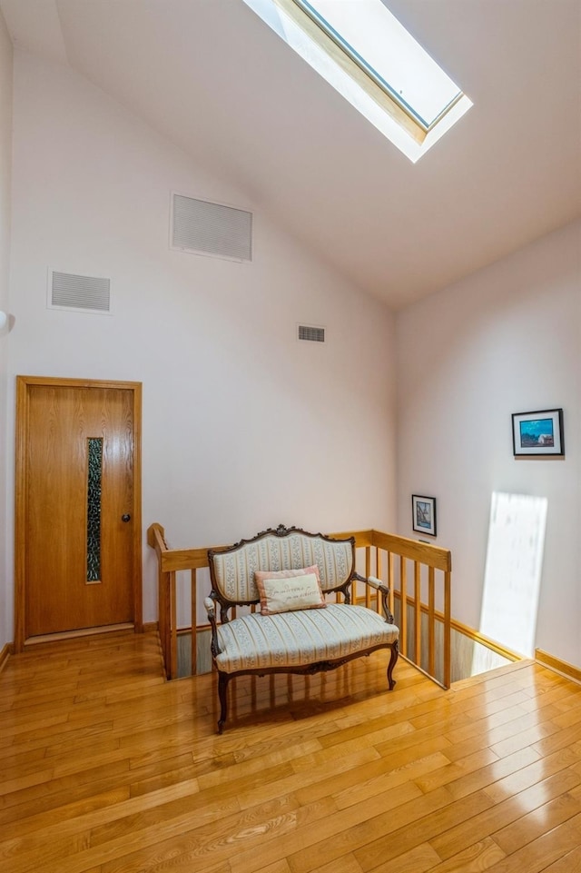19615 Como Ave, Holliswood, NY 11423 - bedroom with wood finished floors, a skylight, and high vaulted ceiling