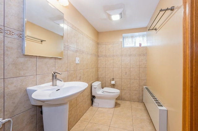 19615 Como Ave, Holliswood, NY 11423 - bathroom with radiator heating unit, tile walls, and tile patterned flooring