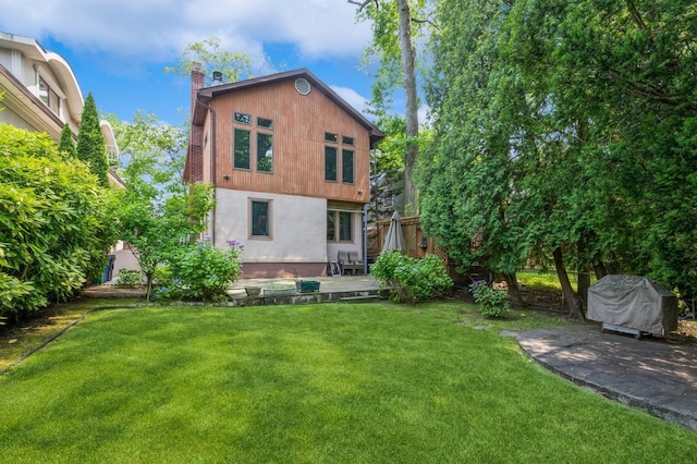 19615 Como Ave, Holliswood, NY 11423 - back of house with a chimney, a yard, and a patio area