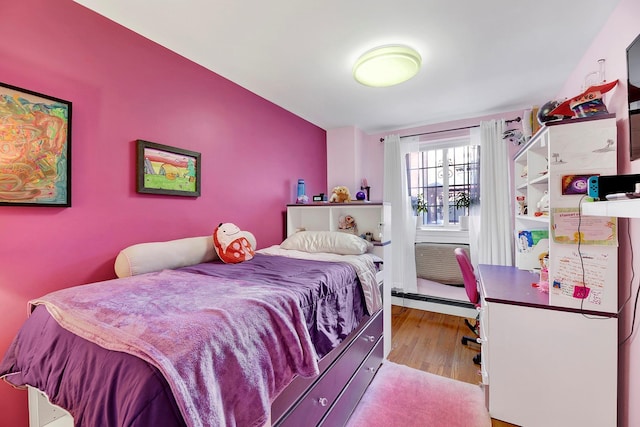 2723 Tilden Ave, Brooklyn, NY 11226 - bedroom featuring wood finished floors and a baseboard radiator