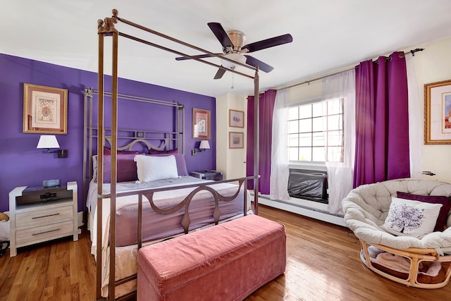 2723 Tilden Ave, Brooklyn, NY 11226 - bedroom featuring baseboard heating, a desk, wood finished floors, and ceiling fan