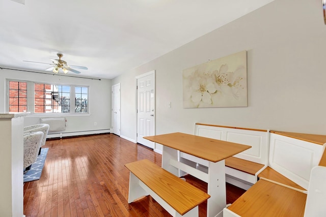 2723 Tilden Ave, Brooklyn, NY 11226 - unfurnished dining area featuring a baseboard radiator, hardwood / wood-style floors, and ceiling fan
