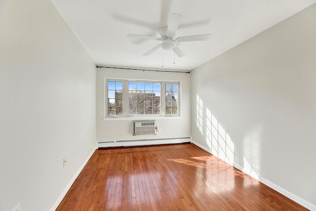 2723 Tilden Ave, Brooklyn, NY 11226 - spare room with a baseboard radiator, hardwood / wood-style flooring, a ceiling fan, and a wall mounted air conditioner