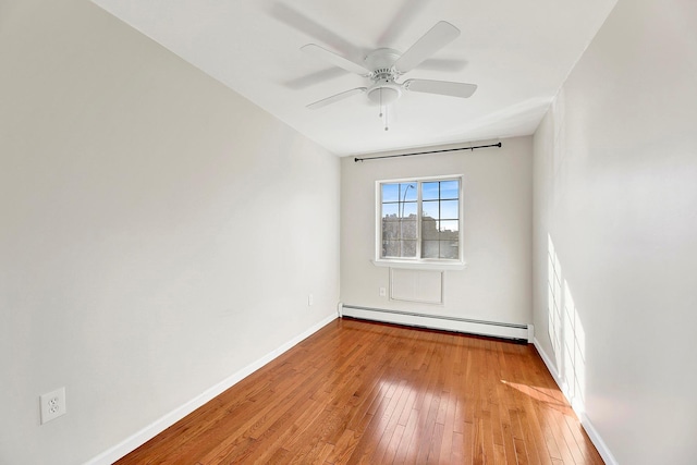 2723 Tilden Ave, Brooklyn, NY 11226 - spare room featuring a baseboard radiator, light wood finished floors, and a ceiling fan