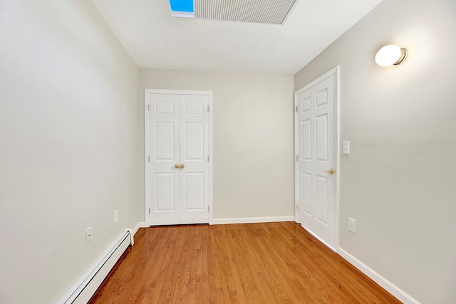2723 Tilden Ave, Brooklyn, NY 11226 - spare room with baseboard heating and light wood finished floors