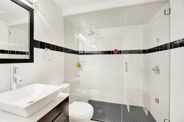 2723 Tilden Ave, Brooklyn, NY 11226 - bathroom featuring tile walls, a shower stall, and vanity
