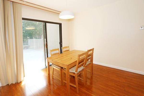 41 Carriage Ct, Jericho, NY 11753 - dining room featuring wood finished floors and baseboards
