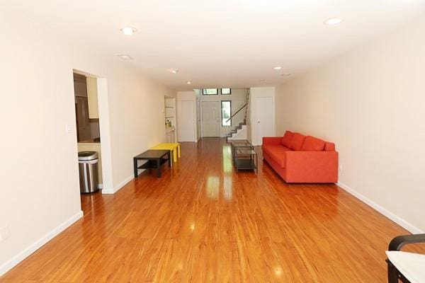 41 Carriage Ct, Jericho, NY 11753 - sitting room featuring light wood-style floors, recessed lighting, and stairs