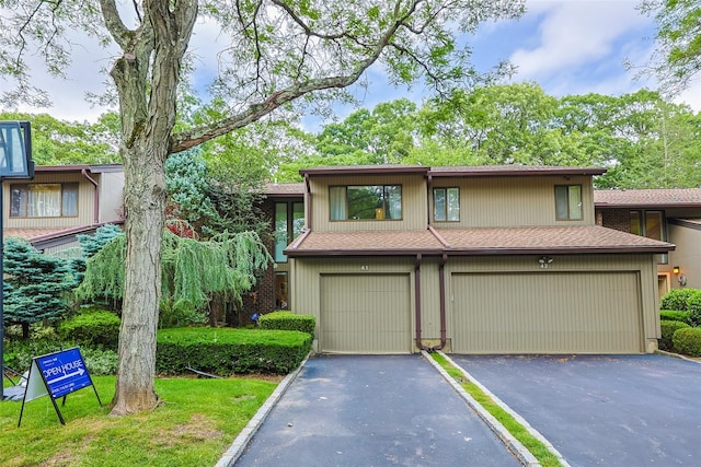 41 Carriage Ct, Jericho, NY 11753 - view of front of property with roof with shingles, a garage, and driveway