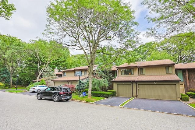 41 Carriage Ct, Jericho, NY 11753 - view of front of property featuring a garage and driveway
