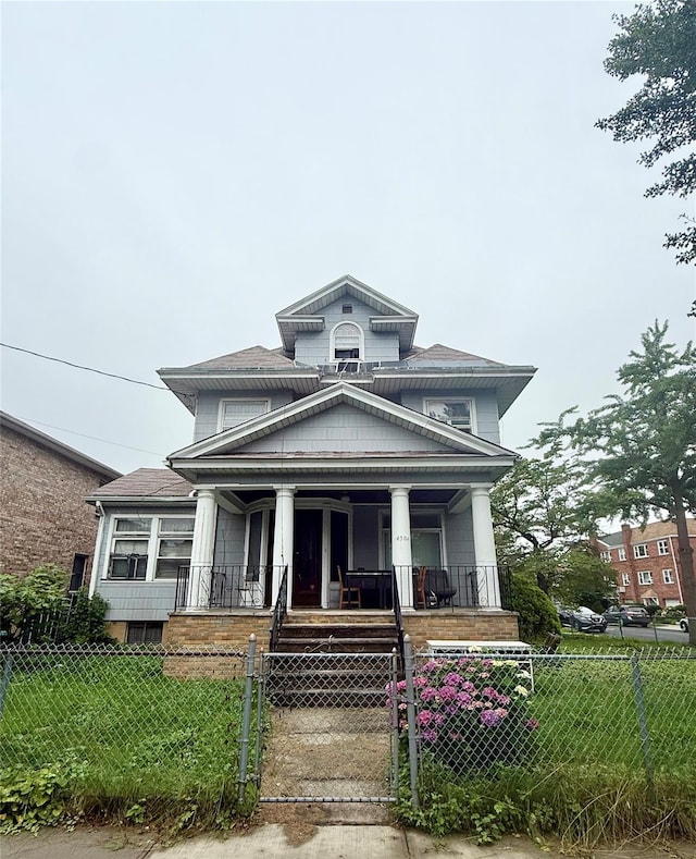 43-04 169th St, Flushing, NY 11358 - view of front of house featuring covered porch, a gate, and a fenced front yard