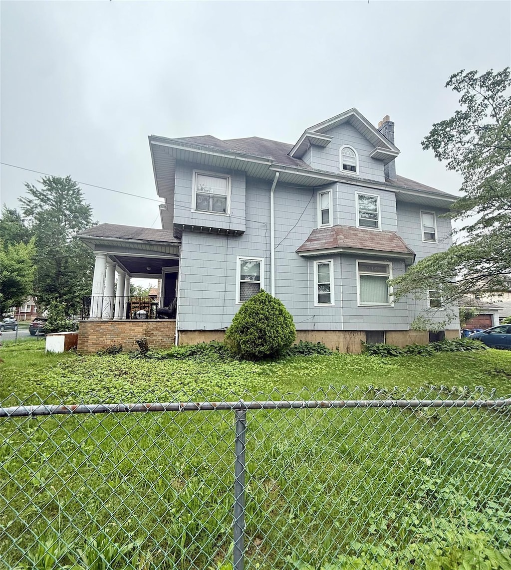 43-04 169th St, Flushing, NY 11358 - view of front of home featuring a chimney