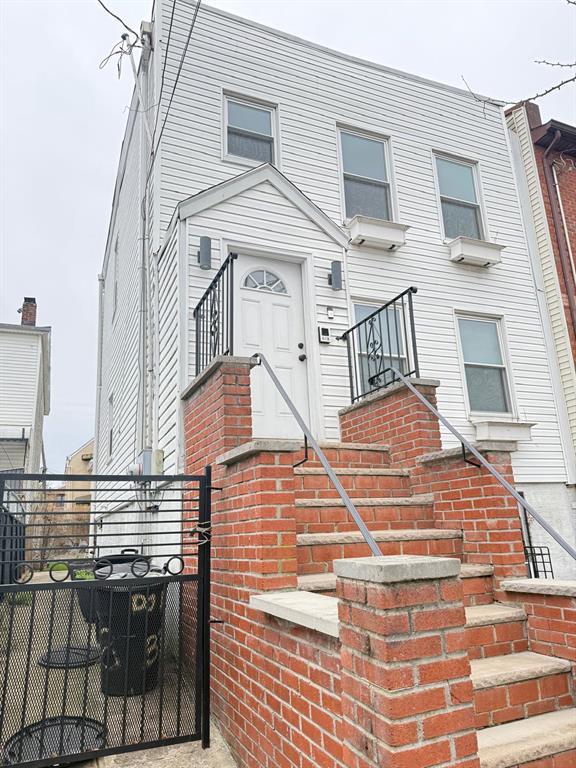 338 Hendrix St, Brooklyn, NY 11207 - view of front facade featuring a gate