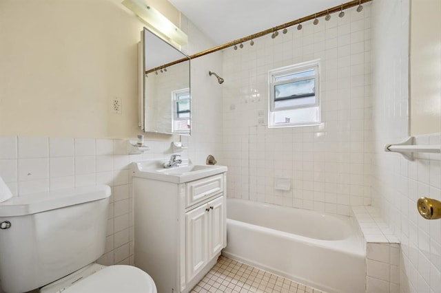 338 Hendrix St, Brooklyn, NY 11207 - bathroom with tile walls, tile patterned floors, shower / tub combination, and vanity