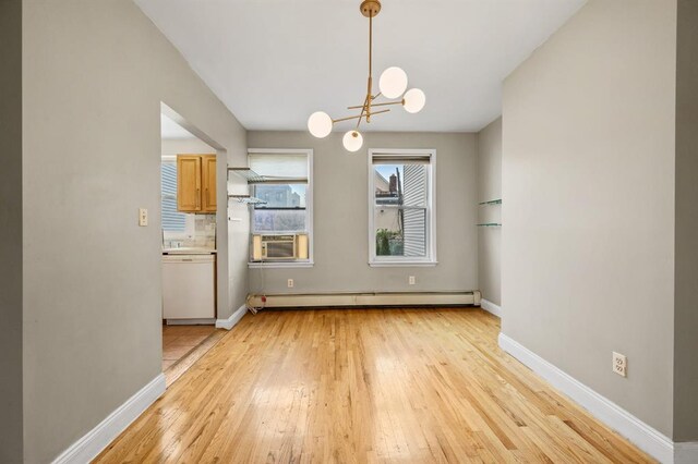 338 Hendrix St, Brooklyn, NY 11207 - unfurnished dining area with baseboard heating, light wood finished floors, a chandelier, and cooling unit