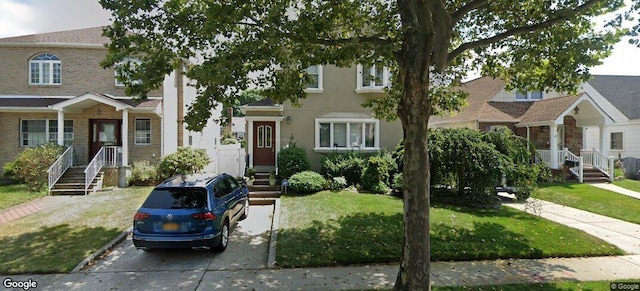 84-17 247th St, Bellerose, NY 11426 - townhome / multi-family property featuring a front lawn and stucco siding